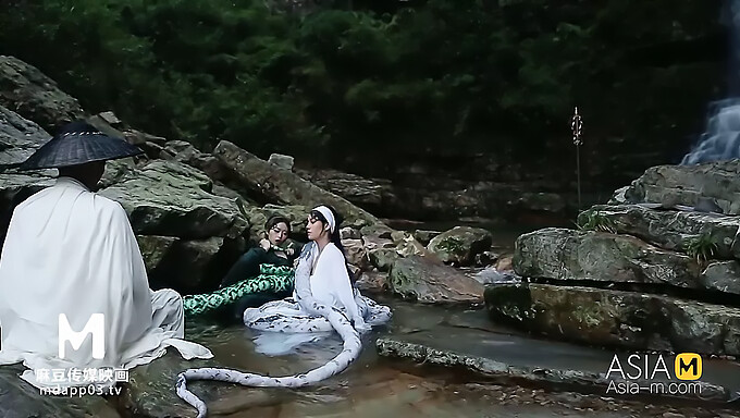 Vintage homemade video of a green and white snake's sexual encounter