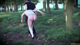 Redhead Forced Into The Woods And Subjected To Bdsm Slave Punishment With Latex, Wax, And A Large Toy