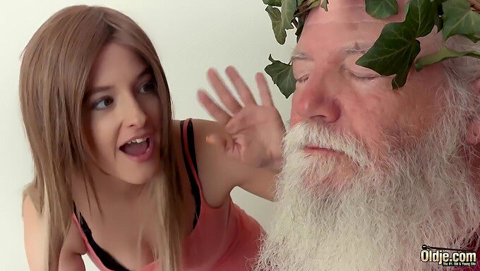 A young girl has sex with an older man who has a white beard